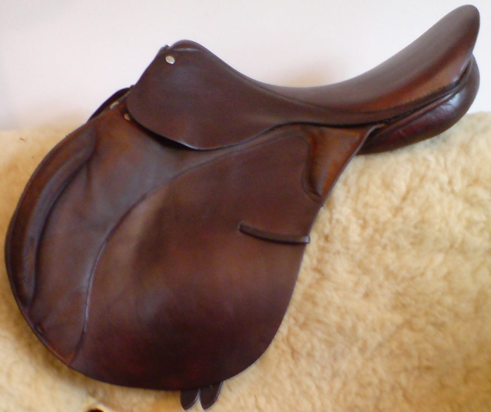 Eventing / jumping saddle — forward-cut flap, grippy seat, security-focused